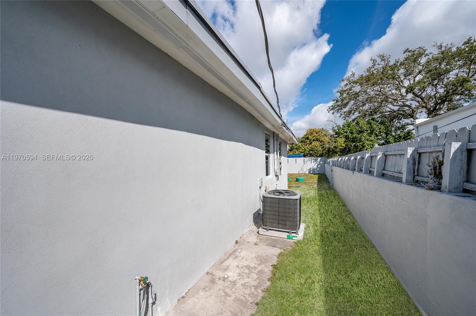2433 Northwest 97th Street Miami, FL 33147 - Photo 24 of 41 a view of a backyard with potted plants