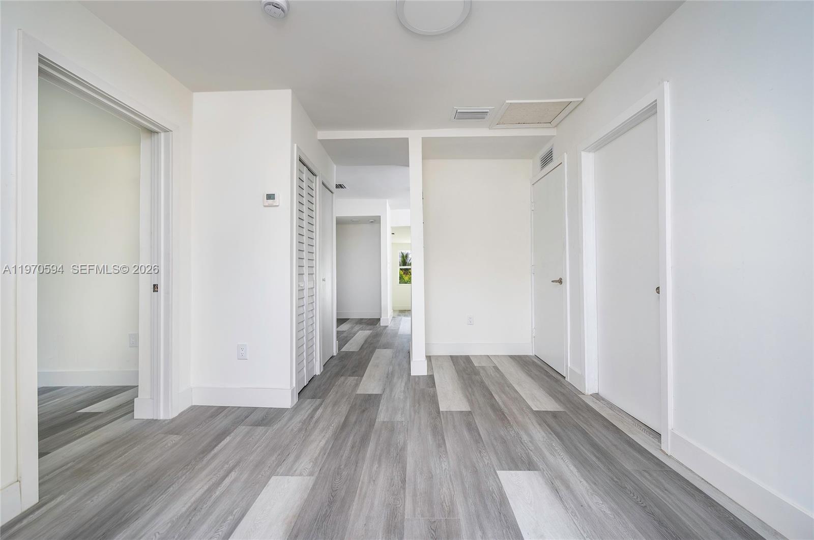 2433 Northwest 97th Street Miami, FL 33147 - Photo 37 of 41 a view of wooden floor in an empty room
