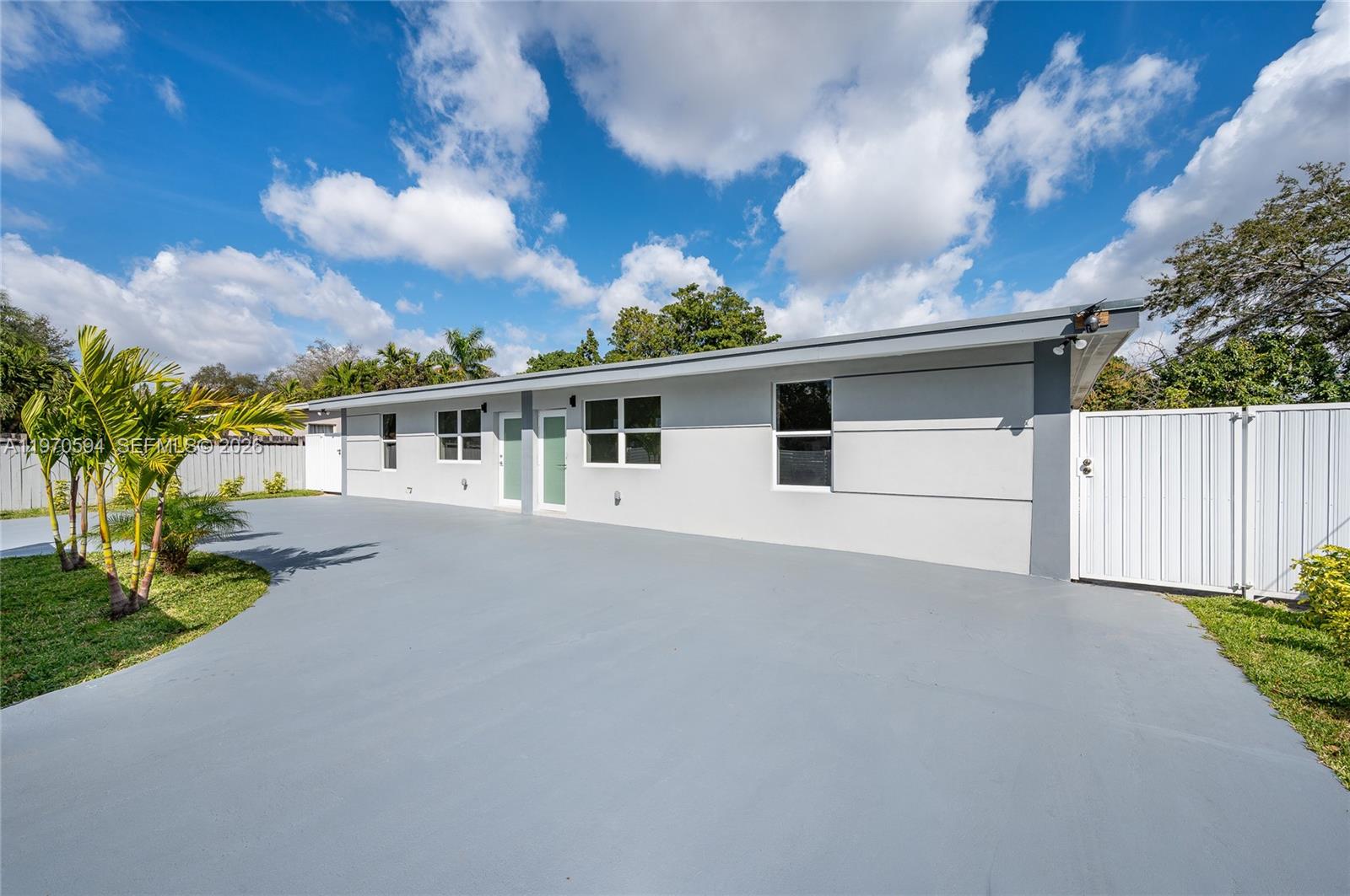 2433 Northwest 97th Street Miami, FL 33147 - Photo 4 of 41 a view of a house with a backyard