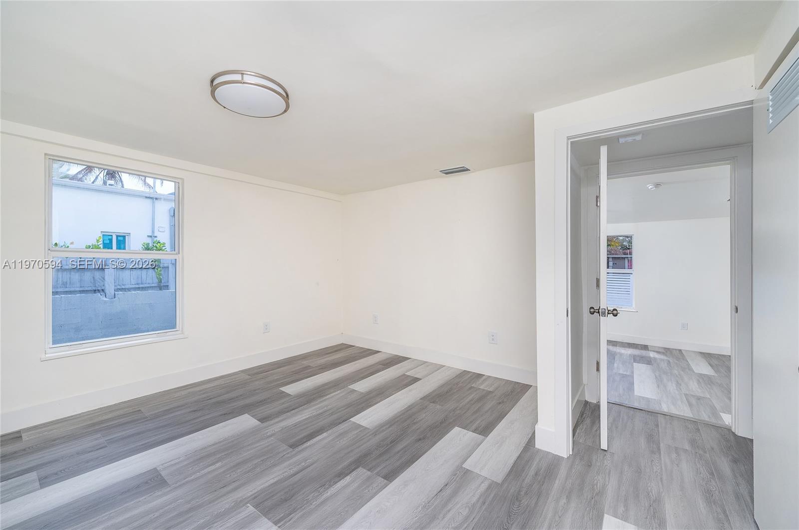 2433 Northwest 97th Street Miami, FL 33147 - Photo 41 of 41 wooden floor in an empty room
