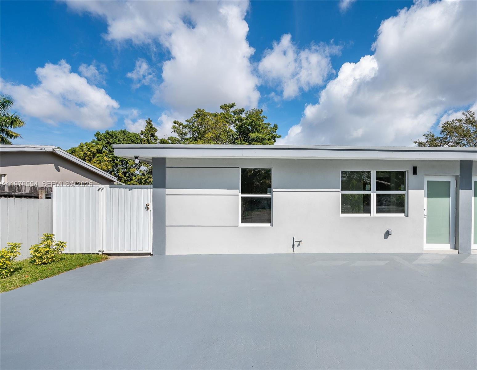 2433 Northwest 97th Street Miami, FL 33147 - Photo 9 of 41 a view of large house with yard