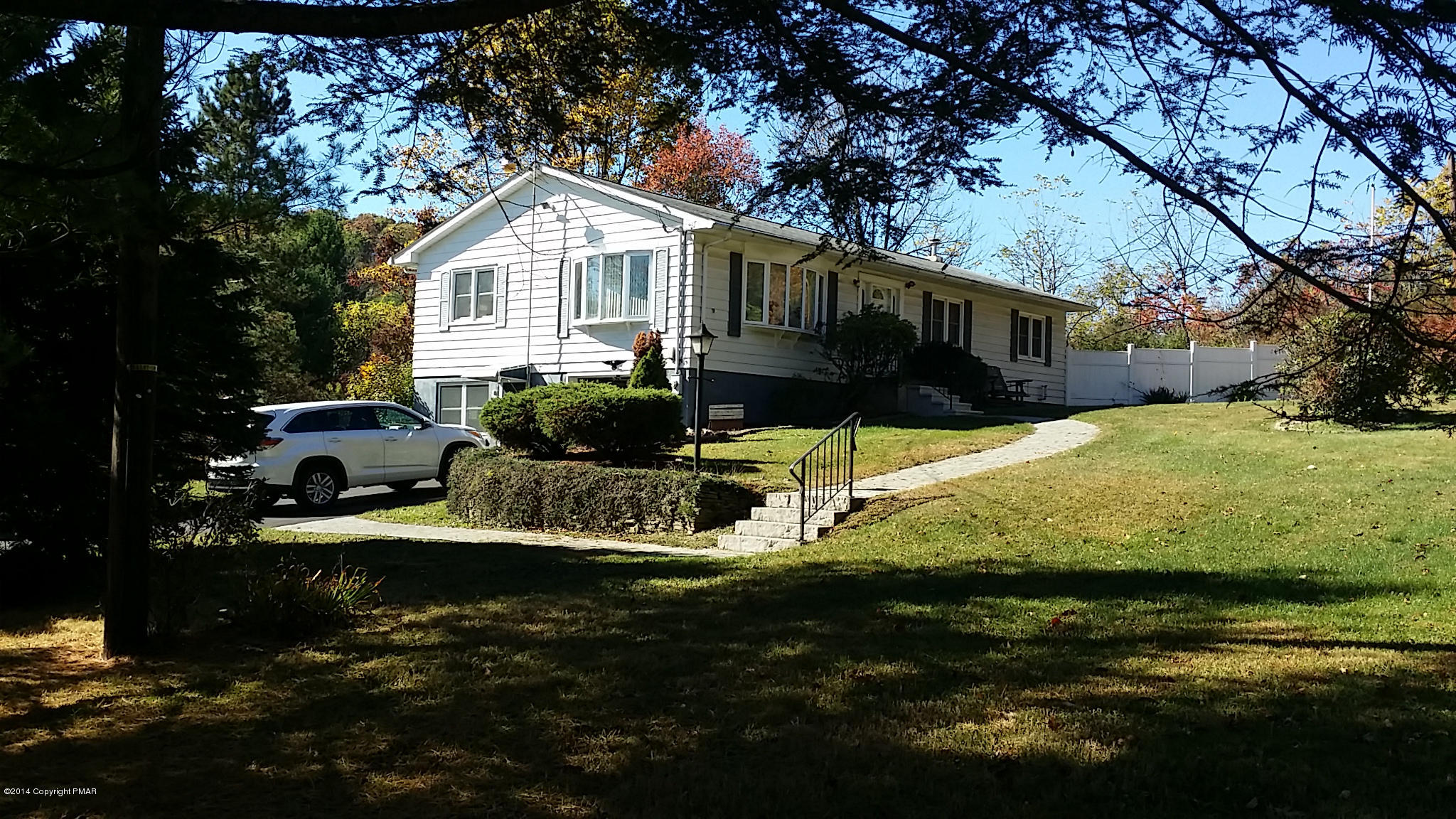 5523 Neola Road Stroudsburg, PA 18360 - Photo 1 of 23 a front view of house with yard and seating area