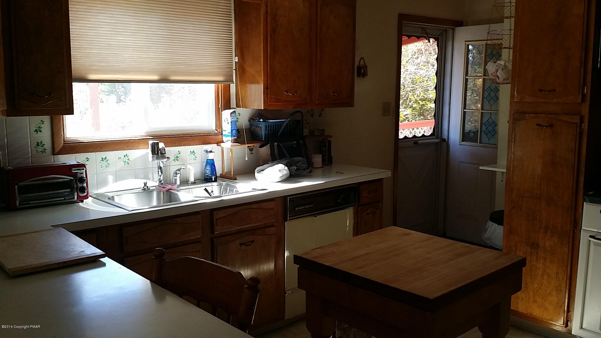 5523 Neola Road Stroudsburg, PA 18360 - Photo 3 of 23 a kitchen with a sink and a window