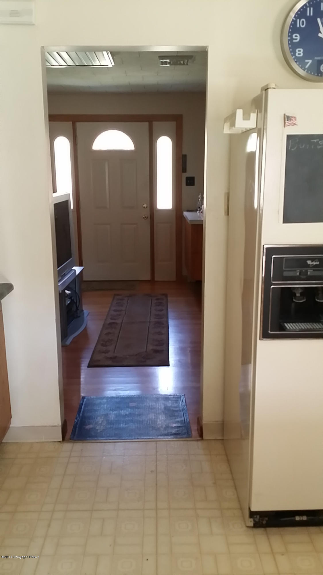 5523 Neola Road Stroudsburg, PA 18360 - Photo 5 of 23 a view of a hallway view with wooden floor and a living room