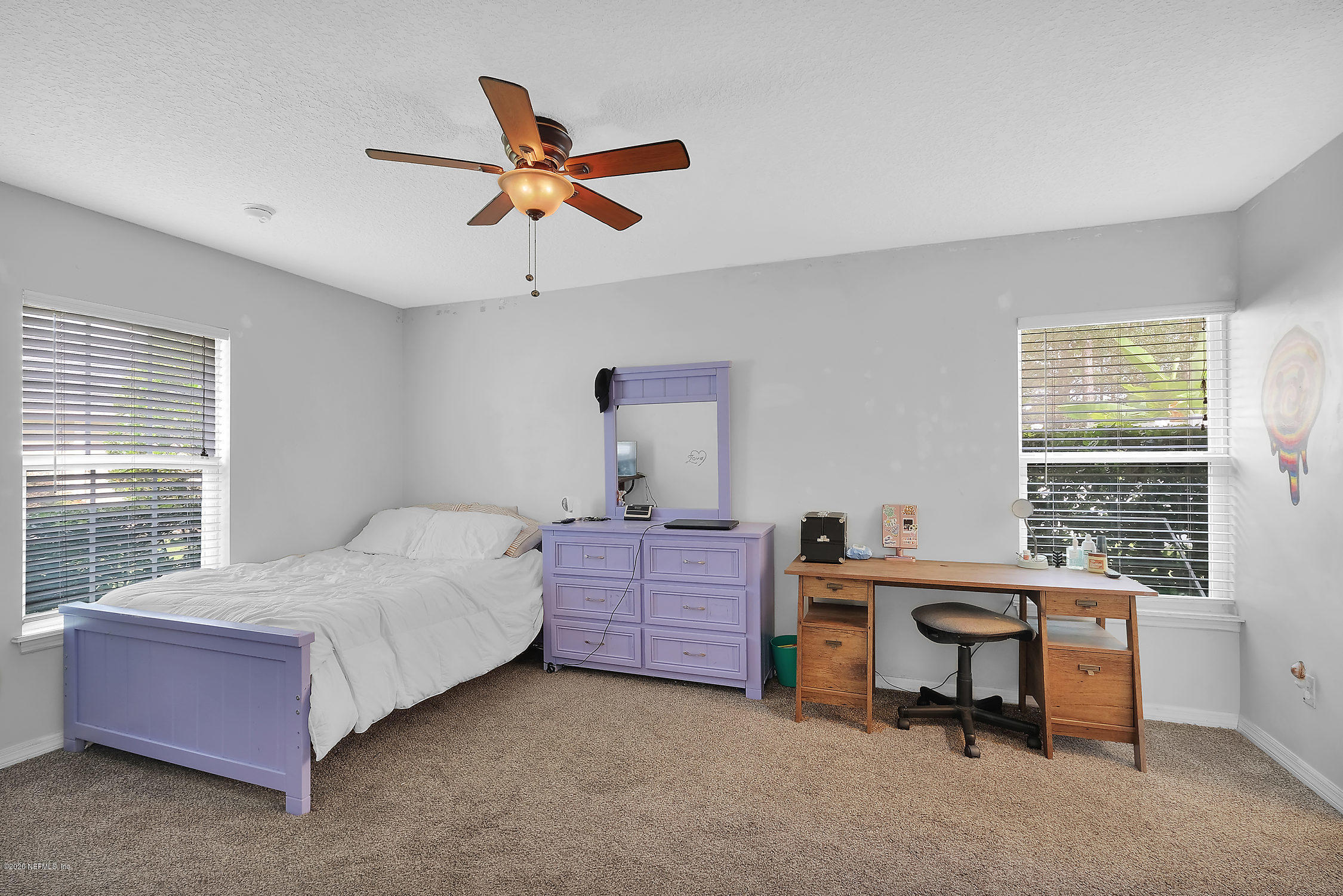 651 Timbermill Lane Orange Park, FL 32065 - Photo 18 of 34 a bedroom with a bed and a window
