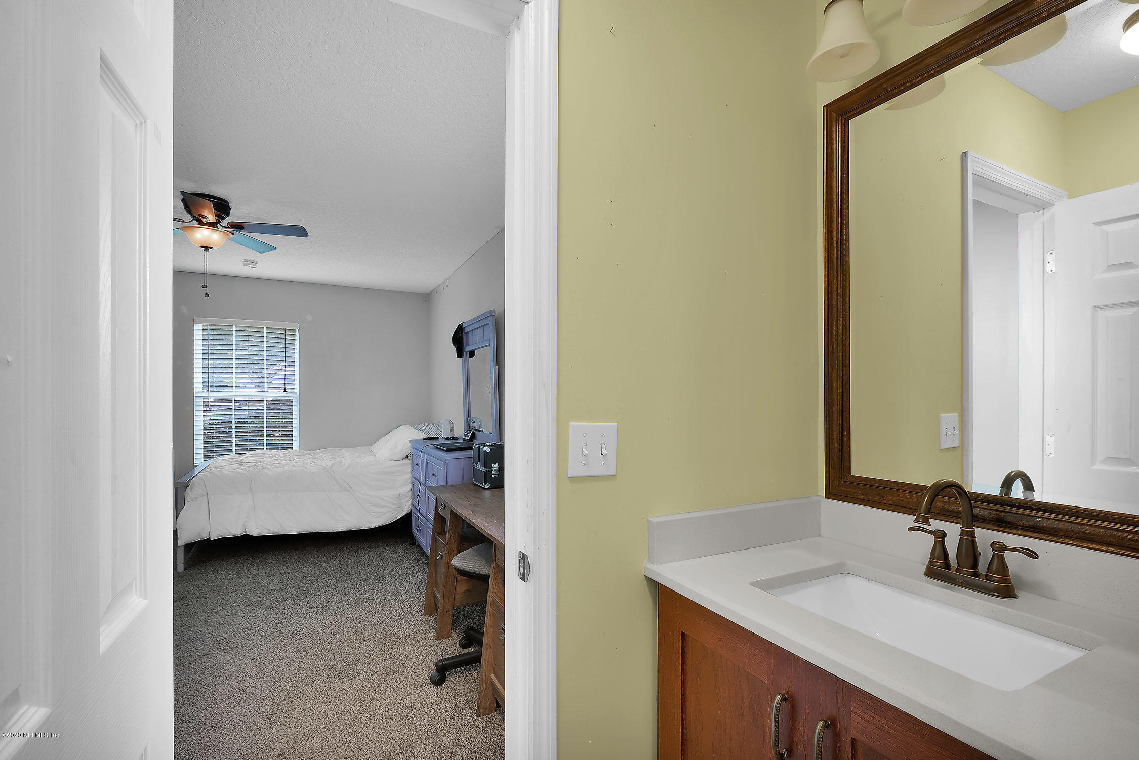 651 Timbermill Lane Orange Park, FL 32065 - Photo 20 of 34 a en suite bathroom with a tub sink and mirror
