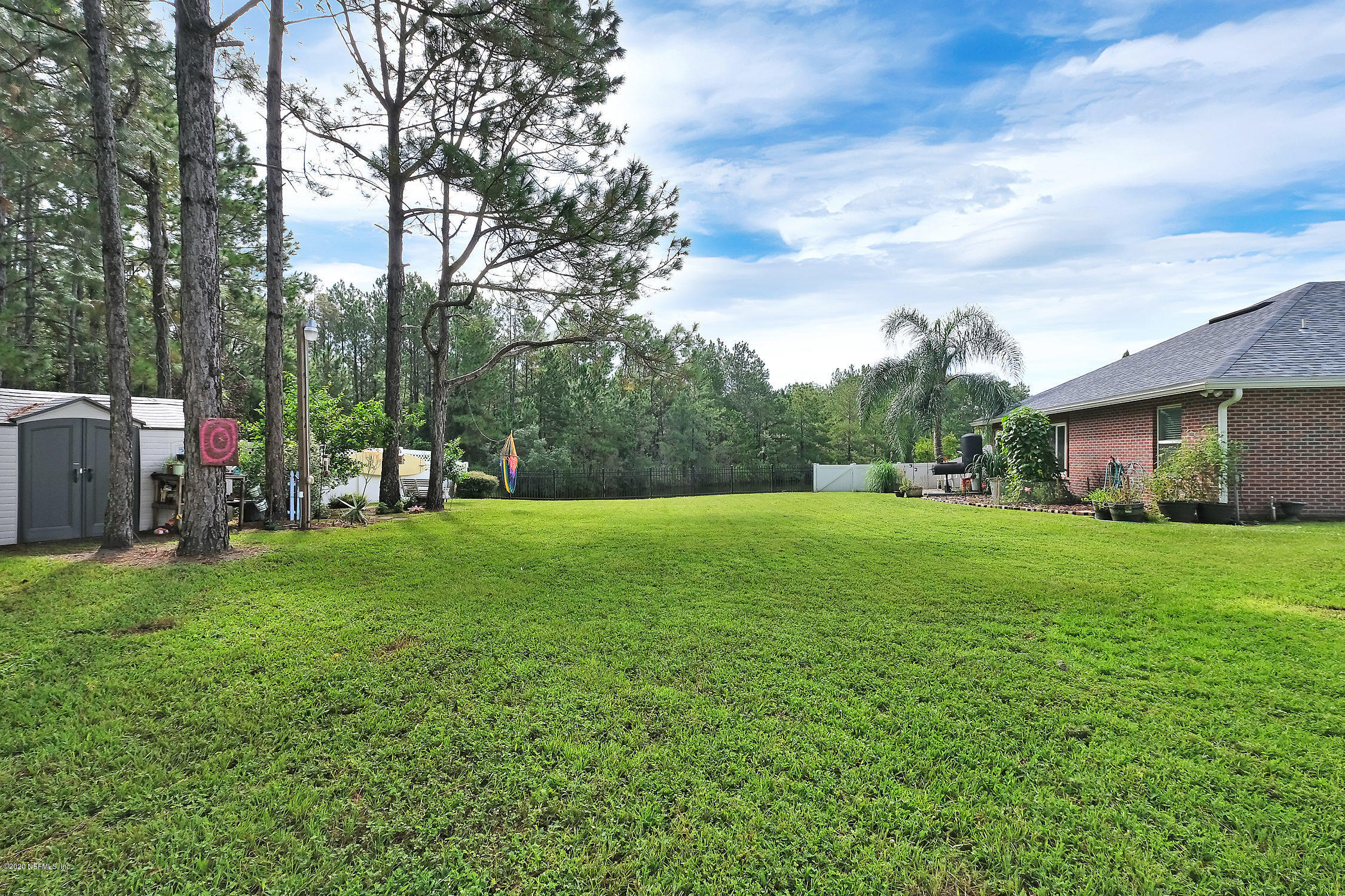 651 Timbermill Lane Orange Park, FL 32065 - Photo 32 of 34 a view of a backyard with large trees
