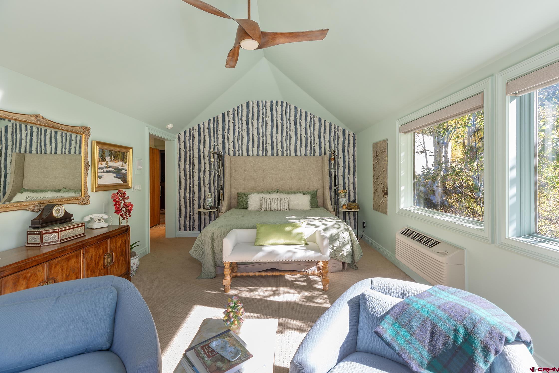 721 East Columbia Avenue Telluride, CO 81435 - Photo 12 of 44 a bedroom with a bed and wooden floor