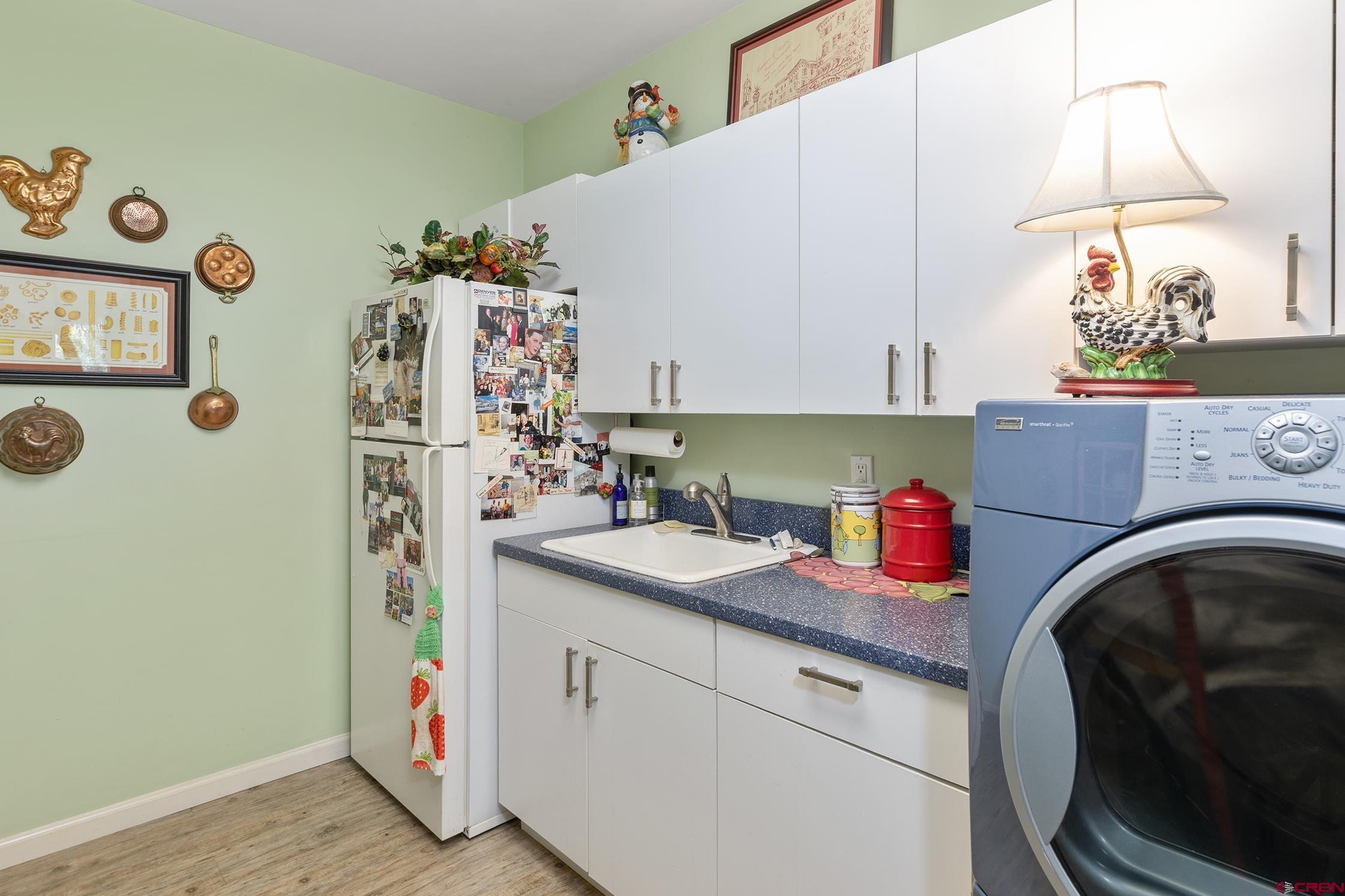 721 East Columbia Avenue Telluride, CO 81435 - Photo 26 of 44 a kitchen with a refrigerator and a sink