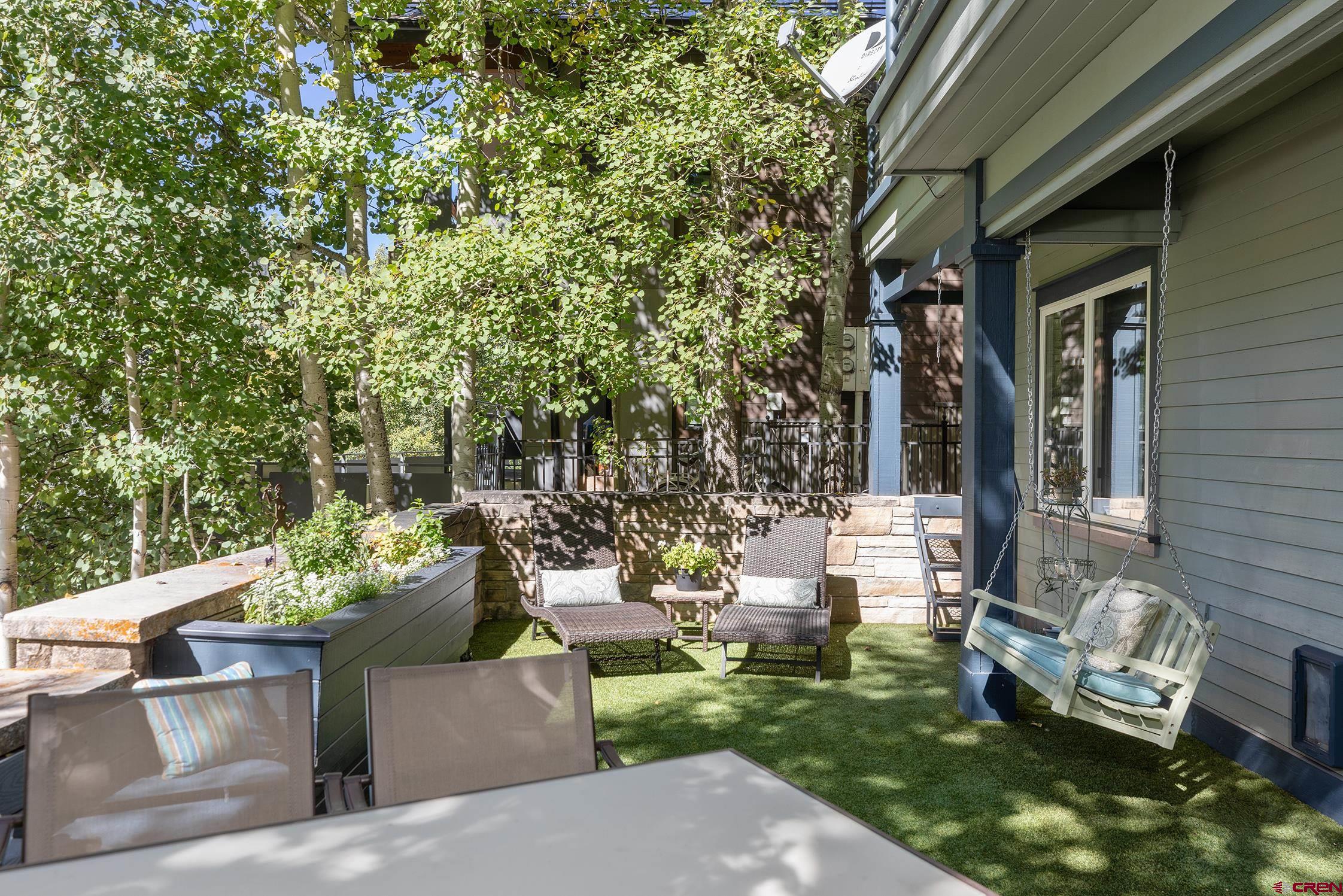 721 East Columbia Avenue Telluride, CO 81435 - Photo 32 of 44 a view of a patio with table and chairs and potted plants