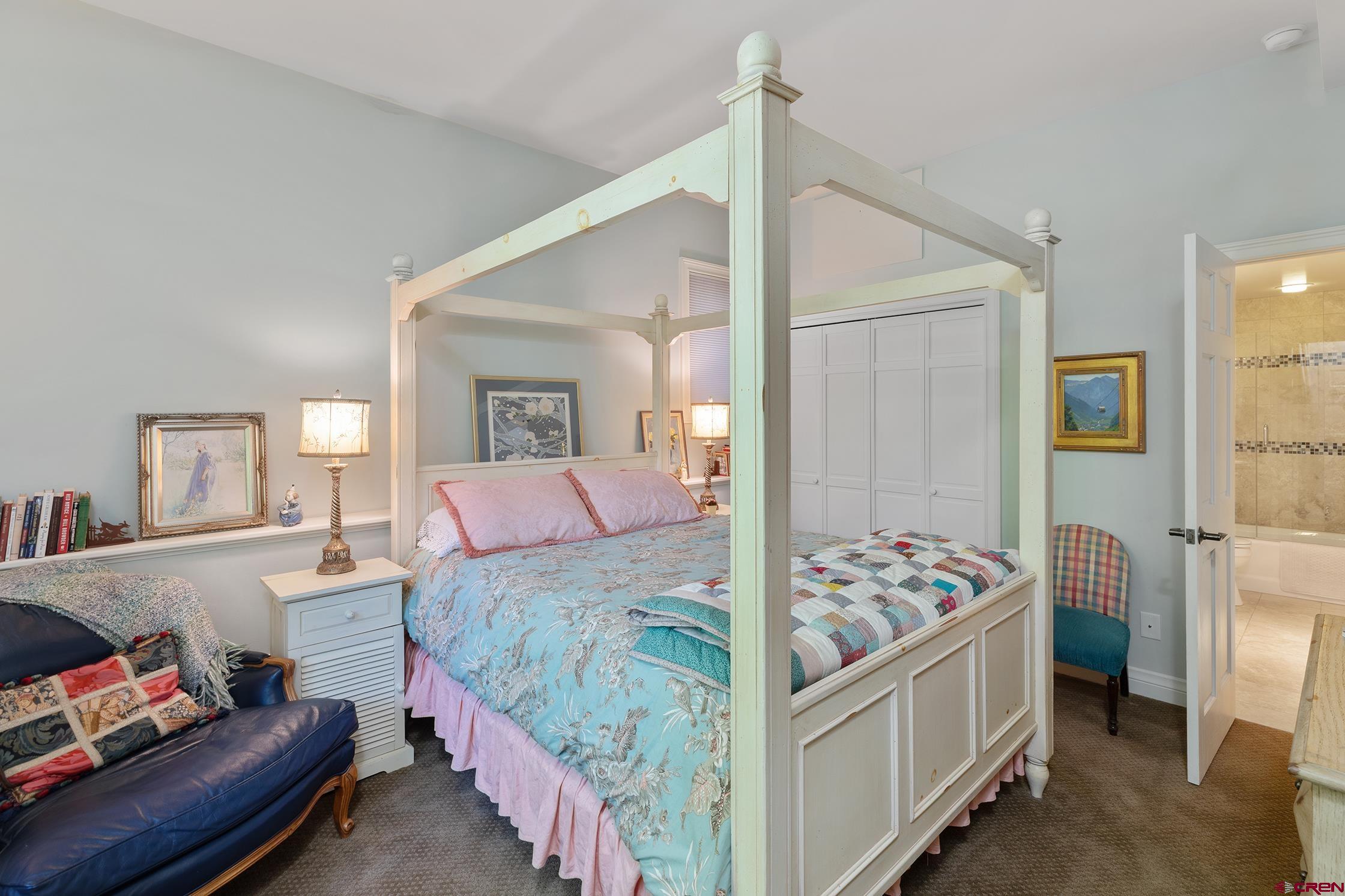 721 East Columbia Avenue Telluride, CO 81435 - Photo 36 of 44 a bedroom with a bed and a dresser in it