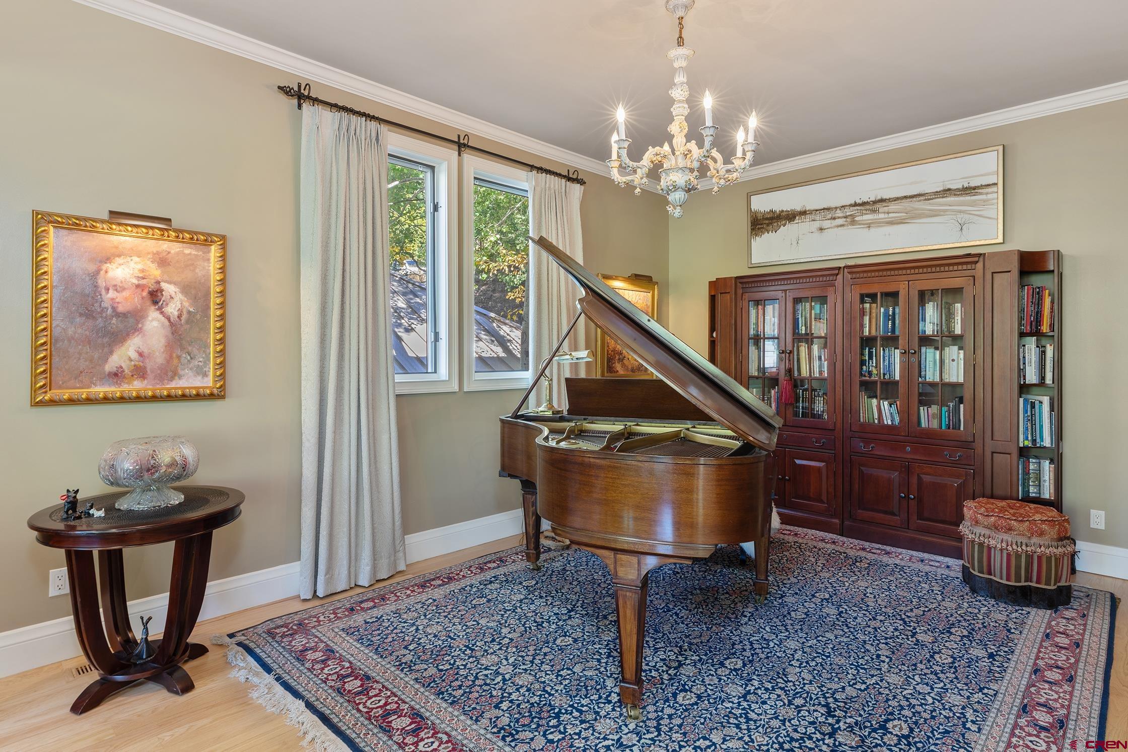 721 East Columbia Avenue Telluride, CO 81435 - Photo 5 of 44 a living room with furniture and a chandelier