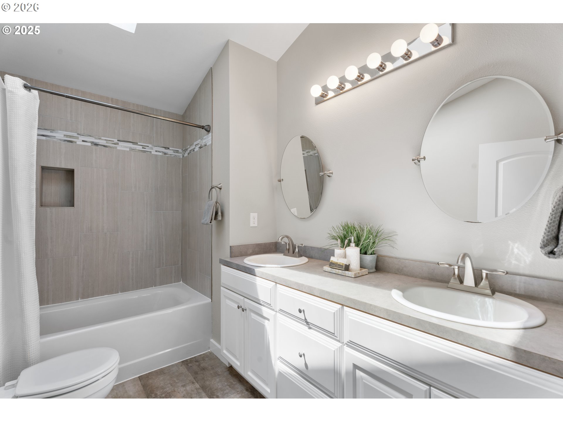 31150 Southwest Wallowa Court Wilsonville, OR 97070 - Photo 11 of 43 a bathroom with a granite countertop sink mirror and a bathtub