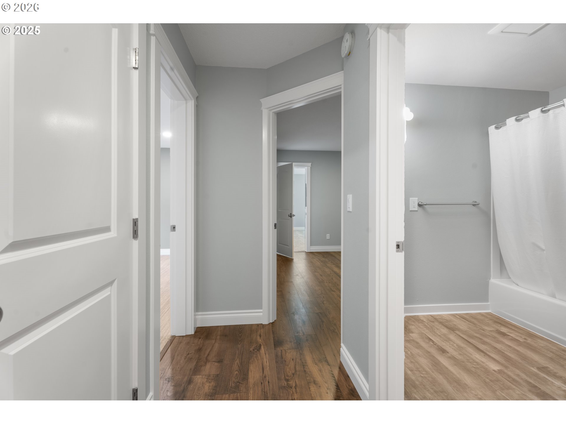 31150 Southwest Wallowa Court Wilsonville, OR 97070 - Photo 15 of 43 a room with wooden floor and a bathroom