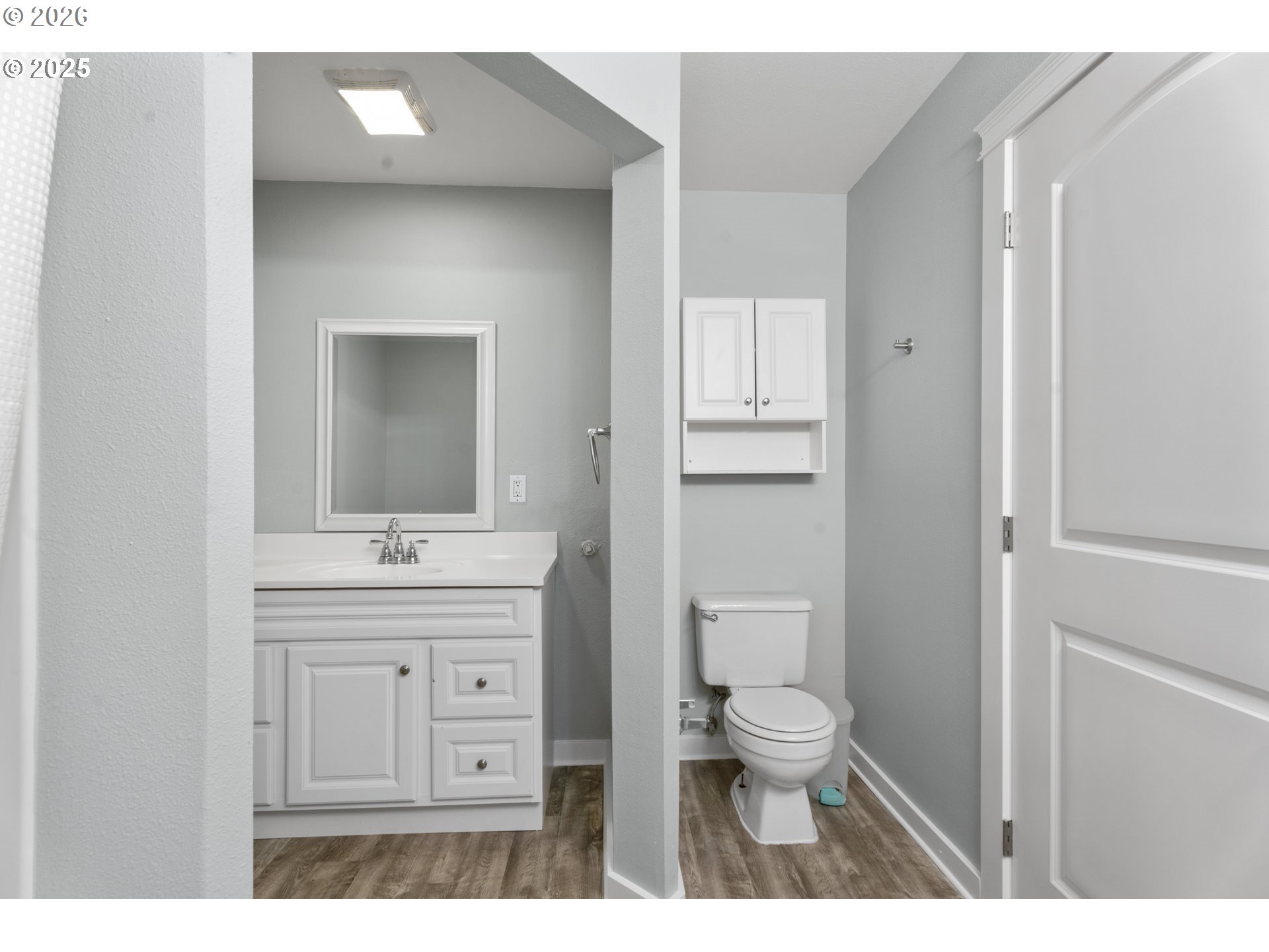 31150 Southwest Wallowa Court Wilsonville, OR 97070 - Photo 17 of 43 a bathroom with a toilet a sink a mirror and vanity