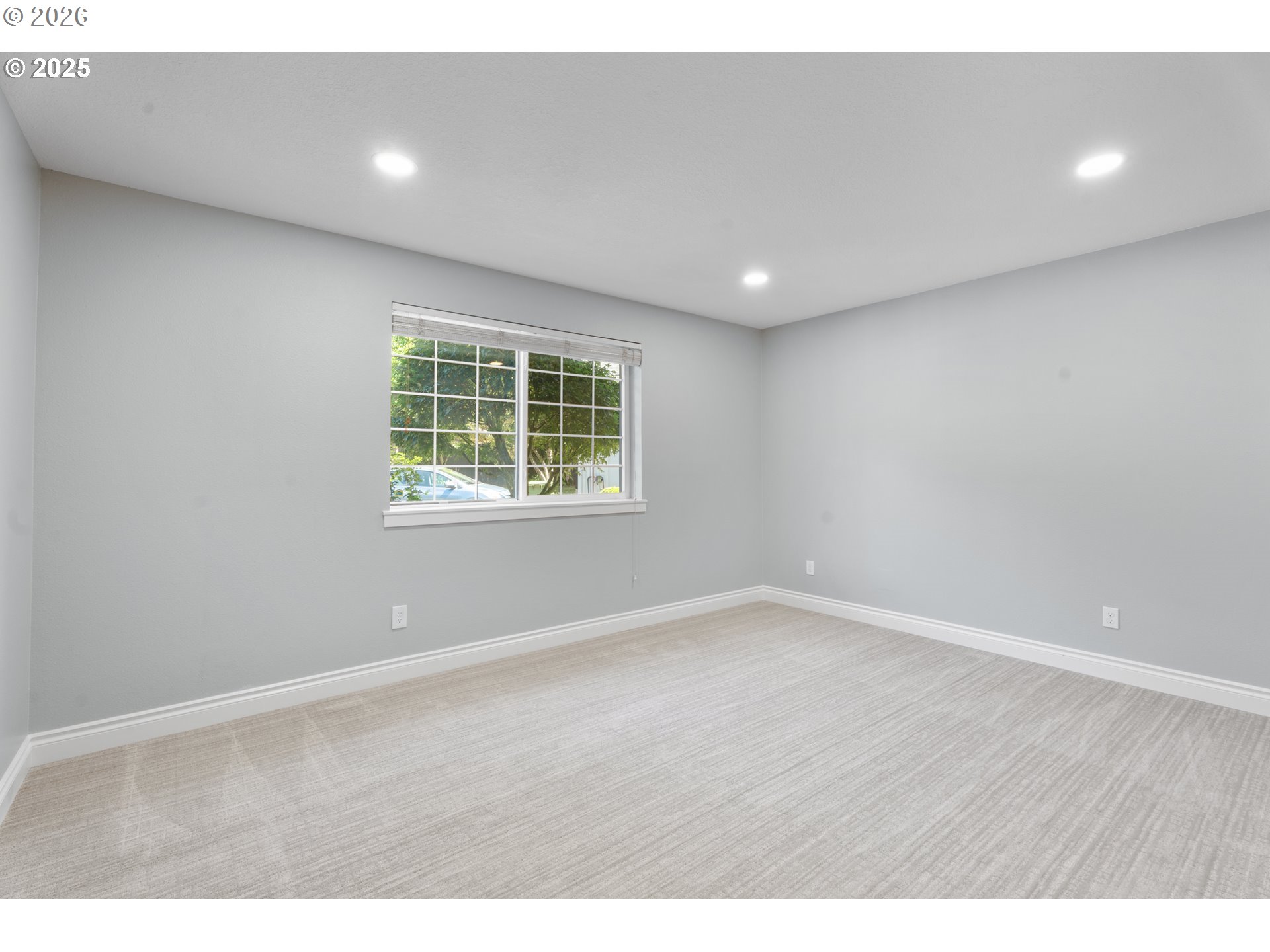 31150 Southwest Wallowa Court Wilsonville, OR 97070 - Photo 19 of 43 a view of an empty room with wooden floor and a window
