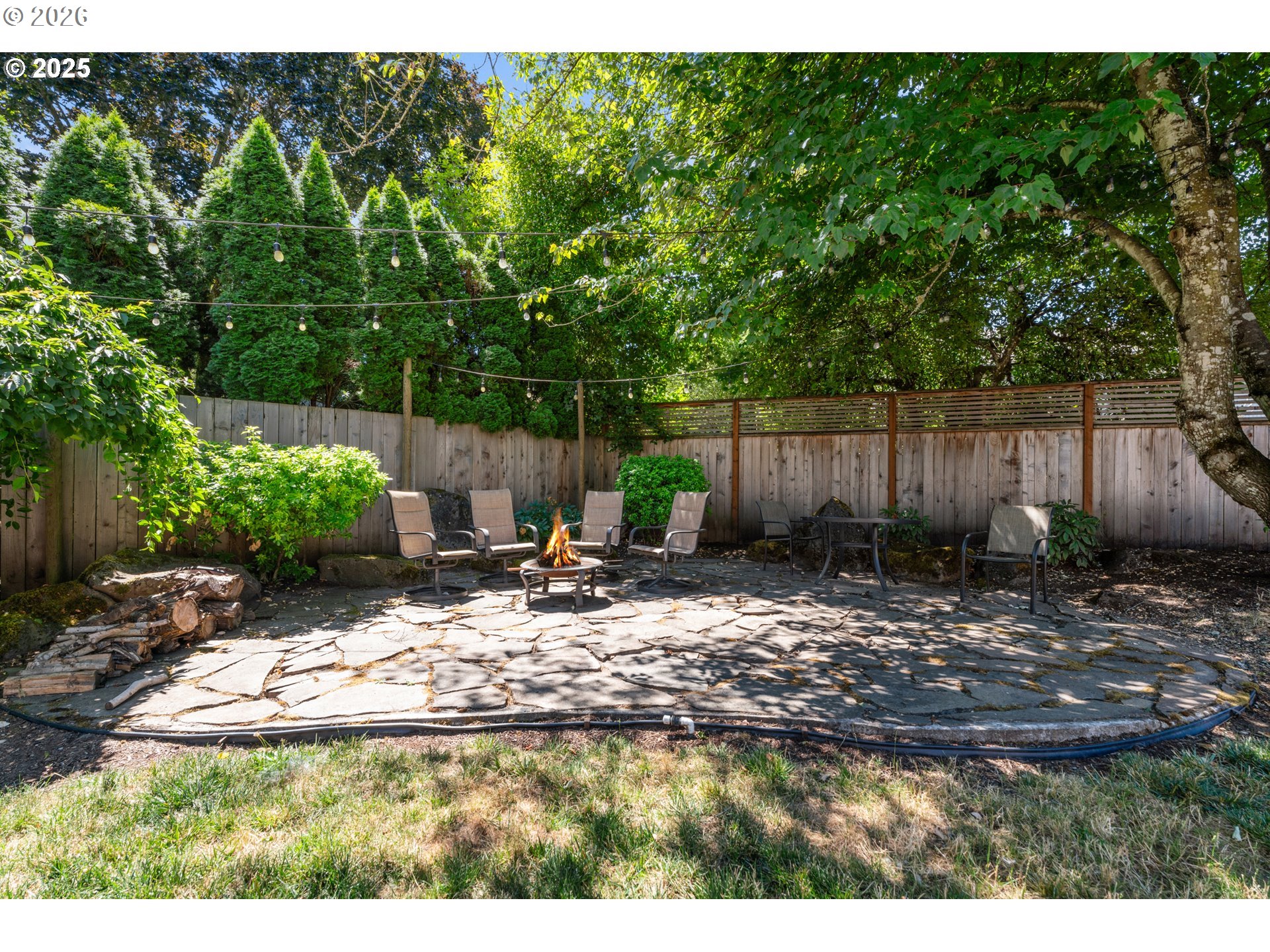 31150 Southwest Wallowa Court Wilsonville, OR 97070 - Photo 29 of 43 a view of a backyard with plants and a lake view