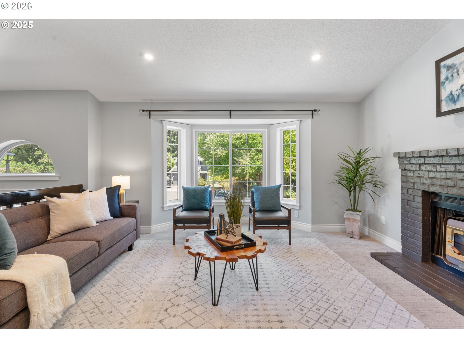 31150 Southwest Wallowa Court Wilsonville, OR 97070 - Photo 34 of 43 a living room with furniture a window and a fireplace