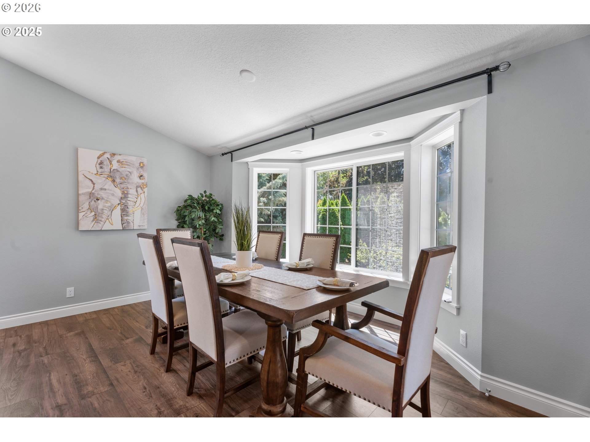 31150 Southwest Wallowa Court Wilsonville, OR 97070 - Photo 5 of 43 a view of a dining room with furniture and wooden floor