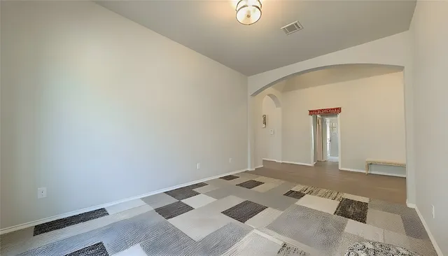 a bathroom with a tub a sink and mirrors