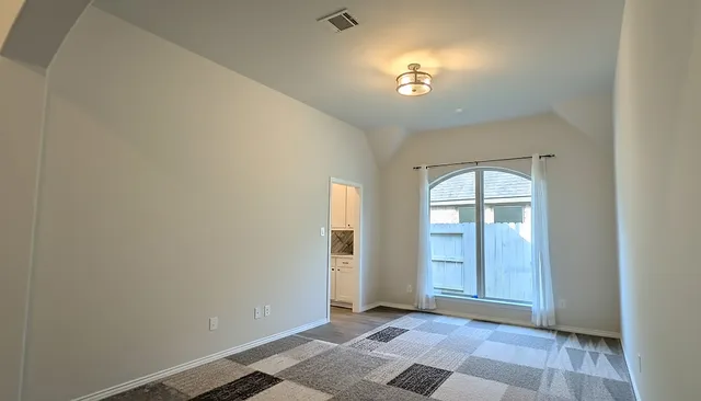 a view of a house with a yard and sitting area
