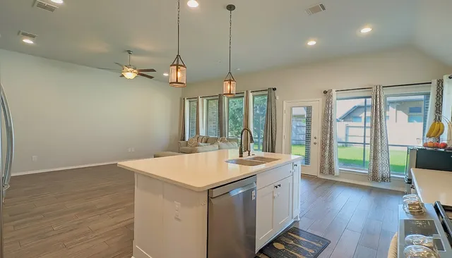an aerial view of a chairs and table on the patio