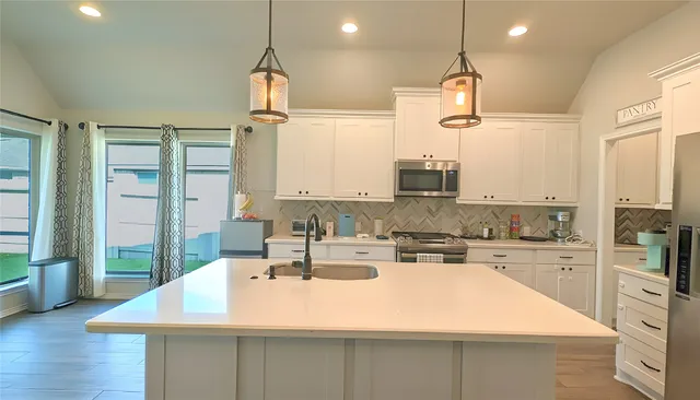 a front view of a house with swimming pool having outdoor seating