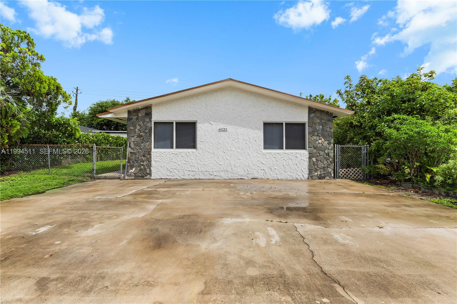 6121 Southwest 40th Court, Unit A Miramar, FL 33023 - Photo 1 of 12 a view of backyard of house with green space
