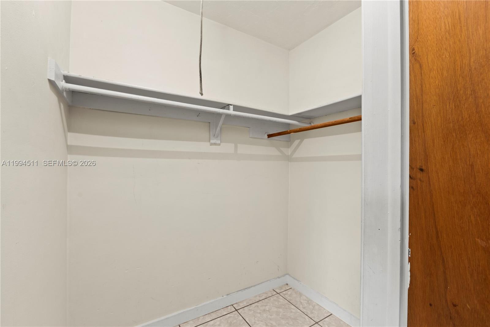 6121 Southwest 40th Court, Unit A Miramar, FL 33023 - Photo 8 of 12 a view of an empty walk in closet