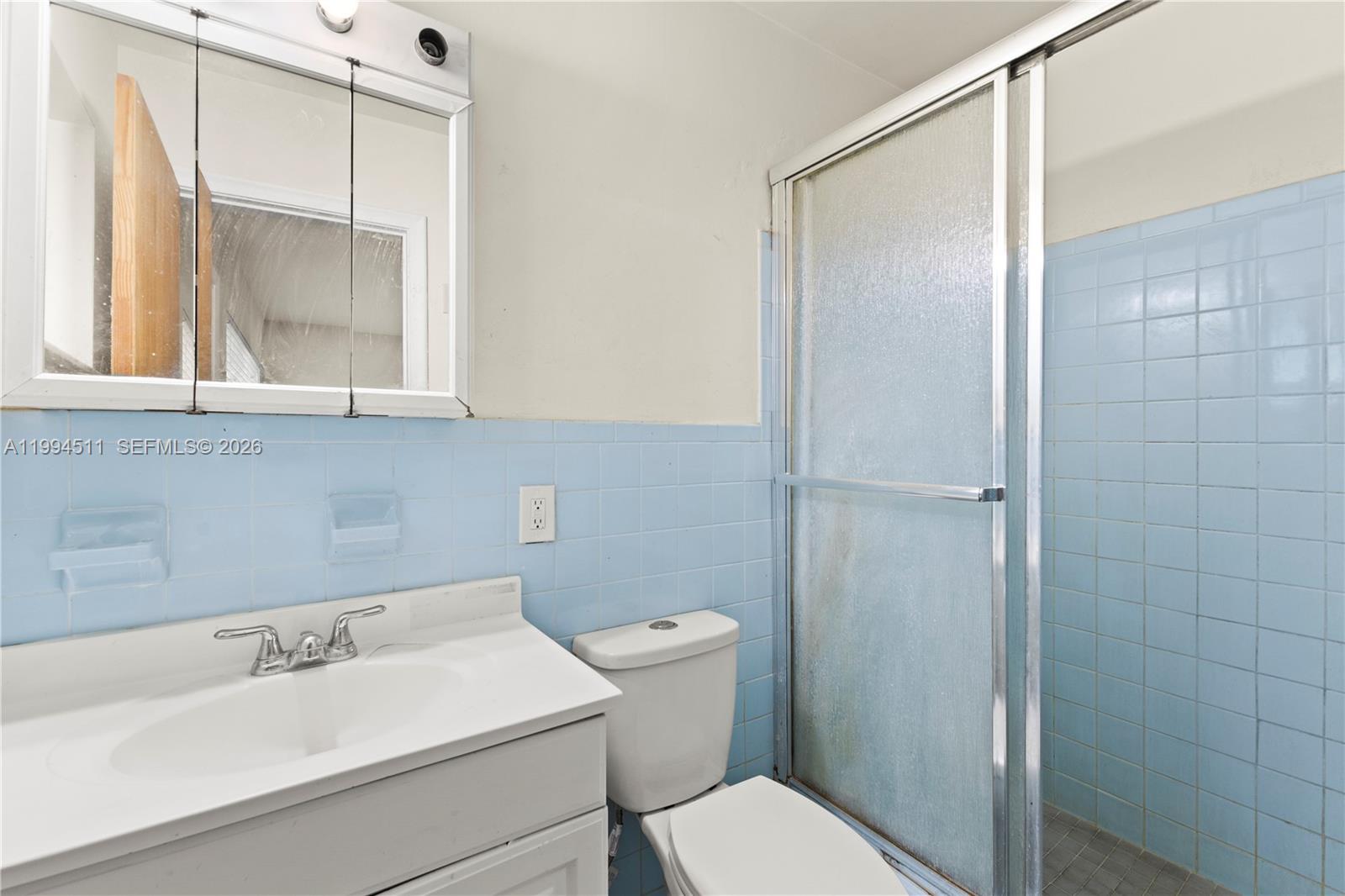 6121 Southwest 40th Court, Unit A Miramar, FL 33023 - Photo 9 of 12 a bathroom with a sink and a toilet