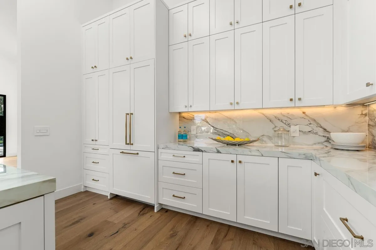 34 Jetty Drive Corona del Mar, CA 92625 - Photo 16 of 33 a view of cabinets with wooden floor