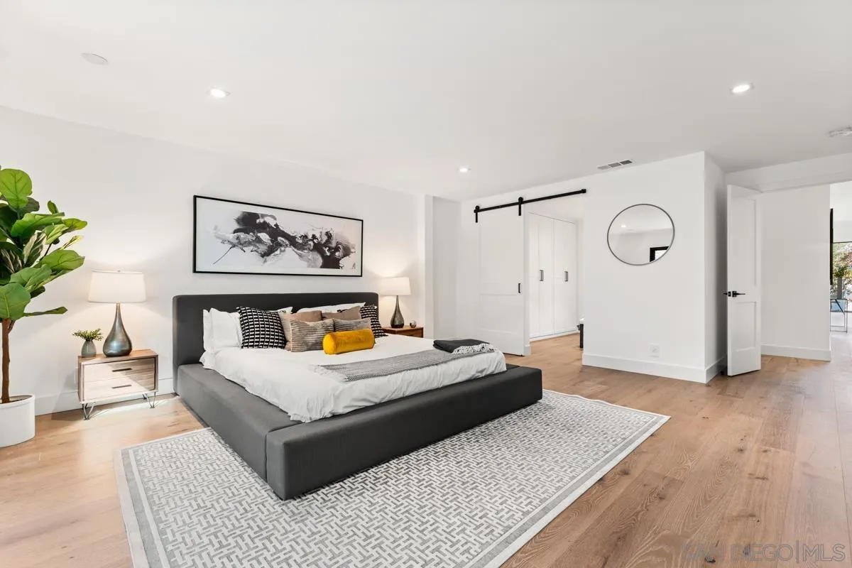 34 Jetty Drive Corona del Mar, CA 92625 - Photo 22 of 33 a bedroom with a bed and a table