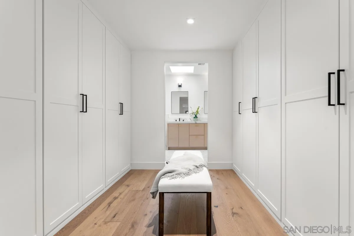 34 Jetty Drive Corona del Mar, CA 92625 - Photo 24 of 33 a bathroom with a sink and a mirror