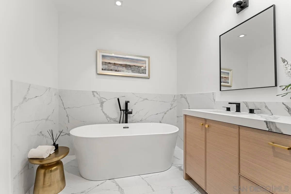 34 Jetty Drive Corona del Mar, CA 92625 - Photo 26 of 33 a bathroom with a bathtub and mirror