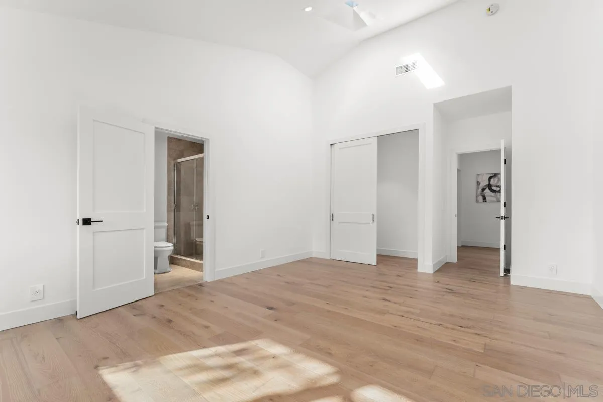 34 Jetty Drive Corona del Mar, CA 92625 - Photo 31 of 33 an empty room with closet and wooden floor