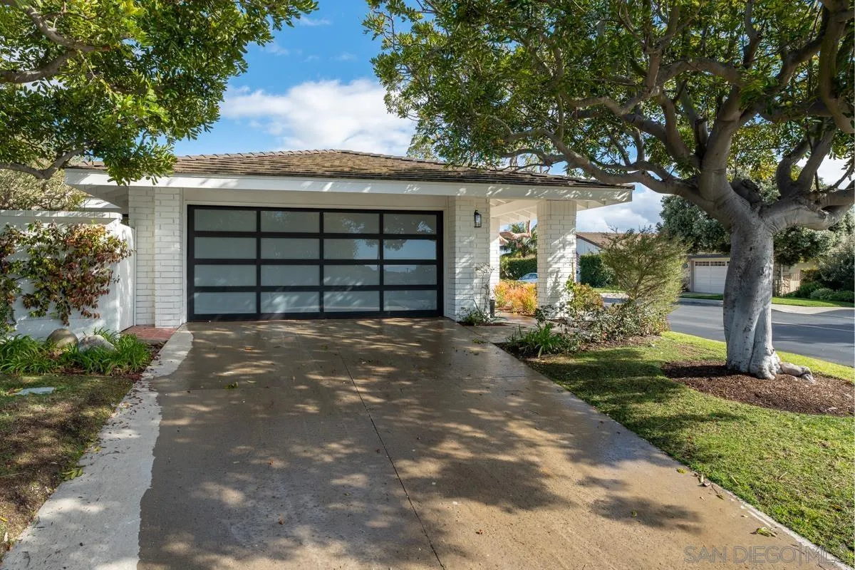 34 Jetty Drive Corona del Mar, CA 92625 - Photo 32 of 33 a front view of a house with a yard and garage