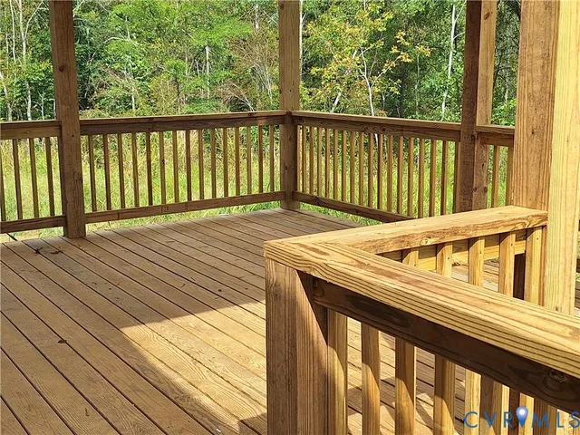 a view of a backyard with wooden fence