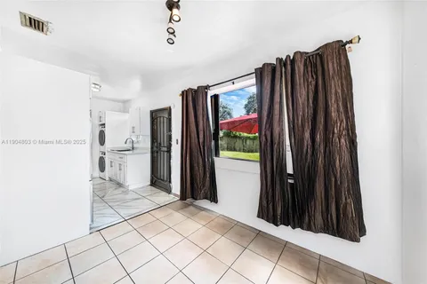 a view of a refrigerator and window