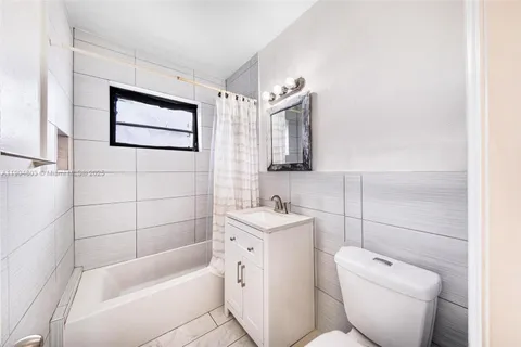 a bathroom with a toilet sink and bathtub