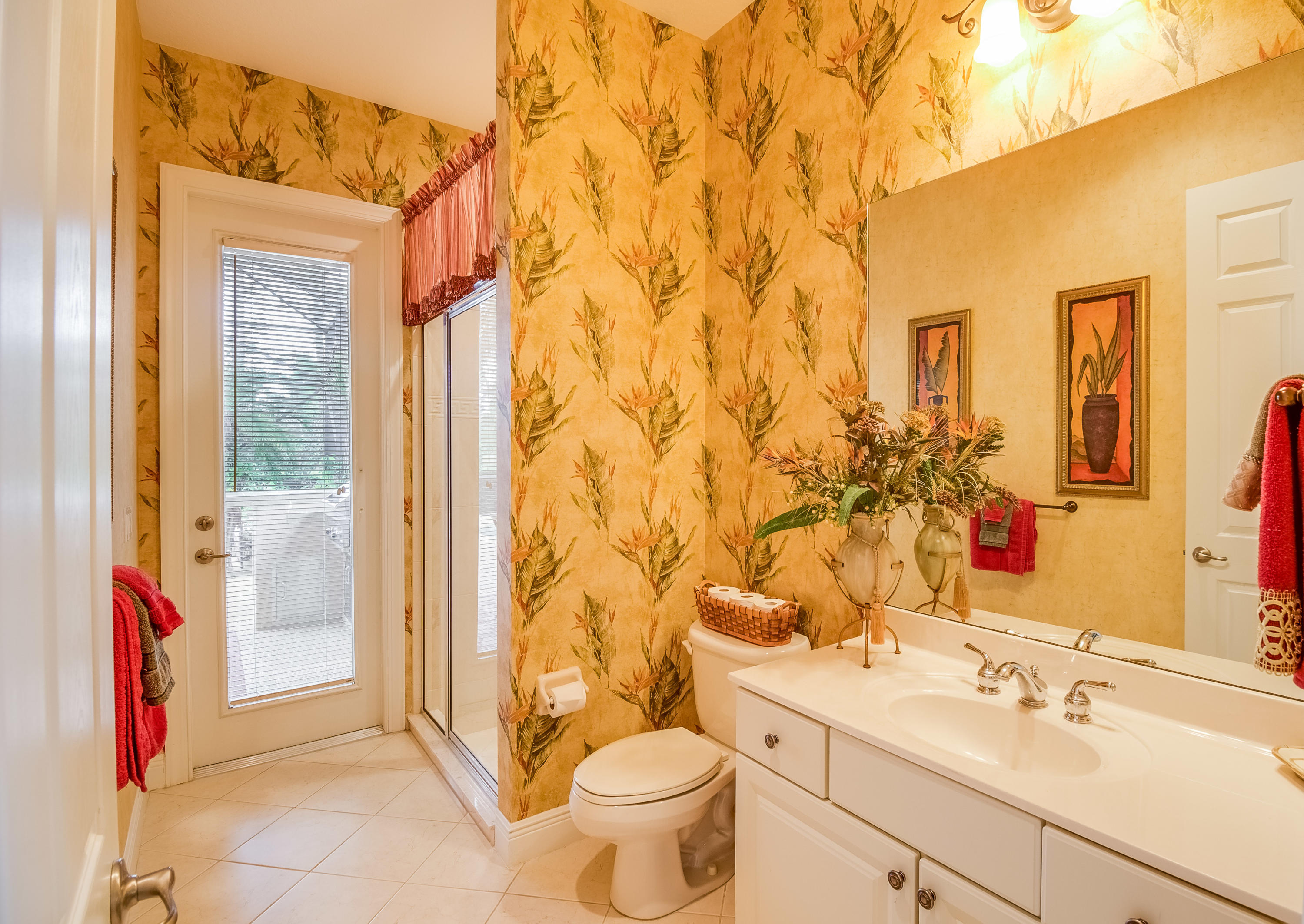 8617 Tompson Point Road Port St. Lucie, FL 34986 - Photo 29 of 38 a bathroom with a sink toilet and shower