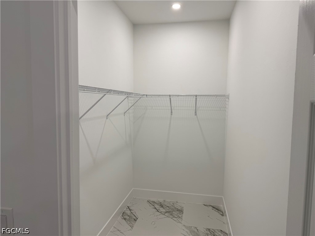 3203 24th Street Southwest Lehigh Acres, FL 33976 - Photo 6 of 19 close up of a white marble wall