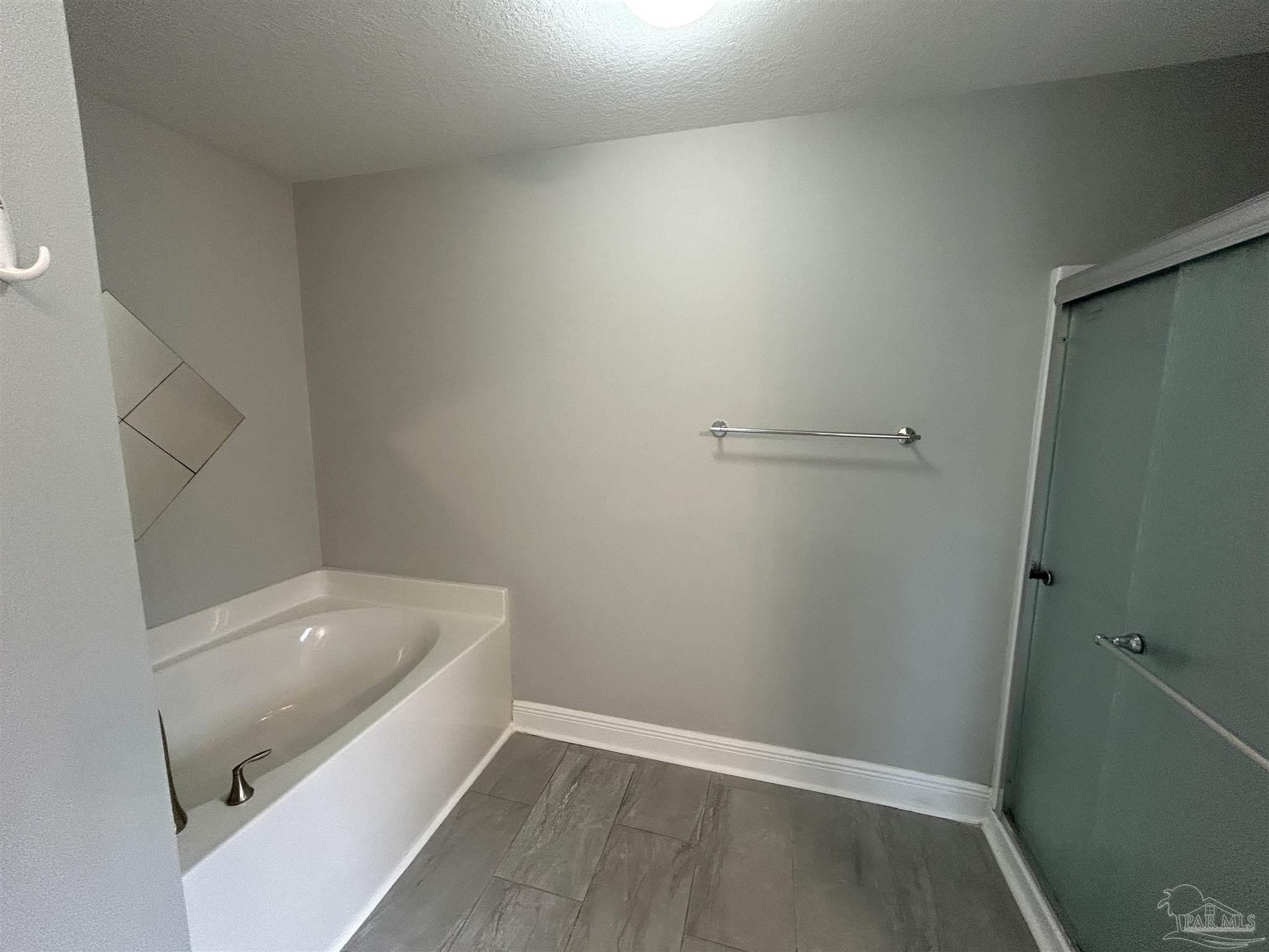 3405 Wasatch Range Loop Pensacola, FL 32526 - Photo 11 of 13 a bathroom with a bathtub