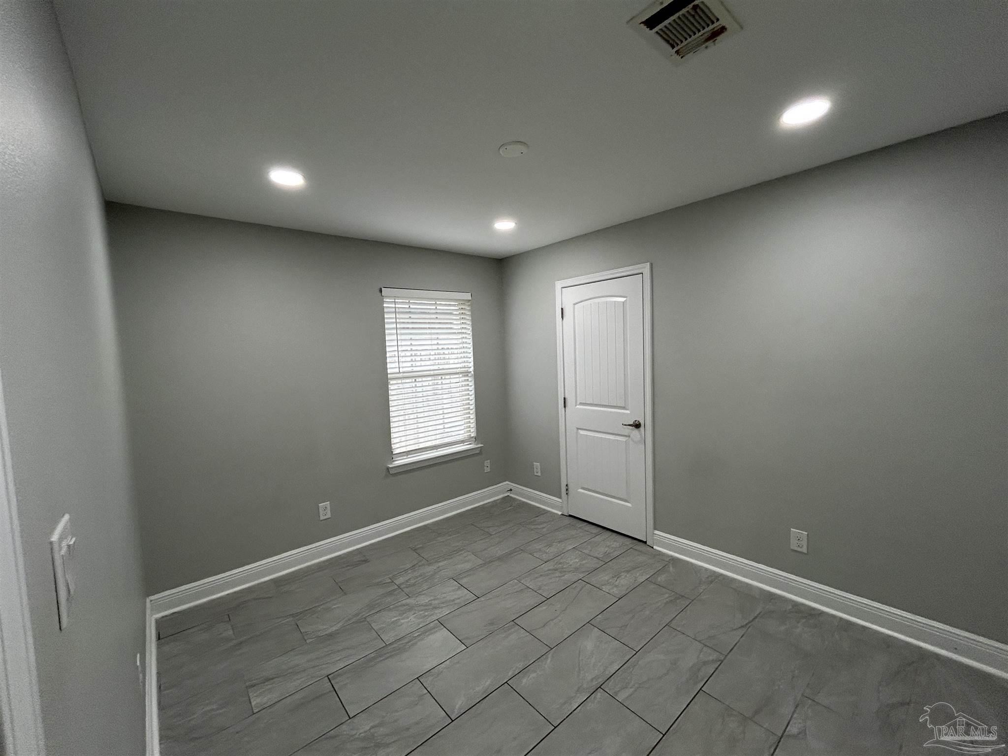 3405 Wasatch Range Loop Pensacola, FL 32526 - Photo 5 of 13 an empty room with windows