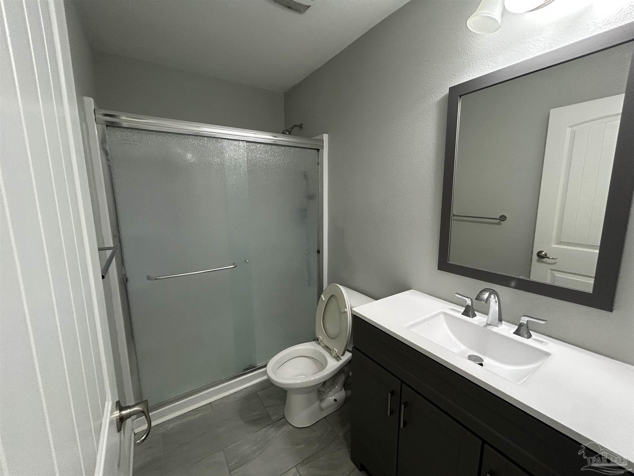 3405 Wasatch Range Loop Pensacola, FL 32526 - Photo 6 of 13 a bathroom with a sink mirror vanity and toilet