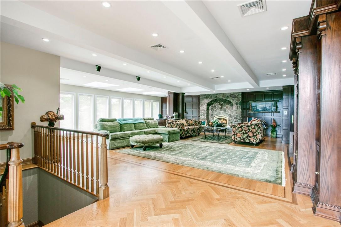 941 Starlight Road Monticello, NY 12701 - Photo 21 of 30 a living room with lots of furniture and a chandelier
