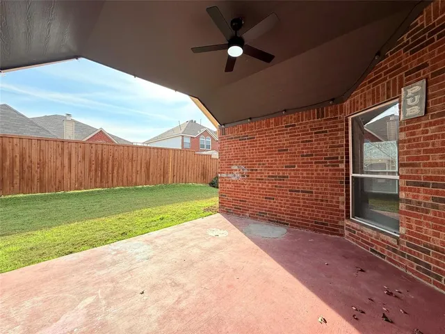 a view of a backyard with grass