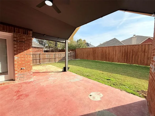 a view of a backyard of the house