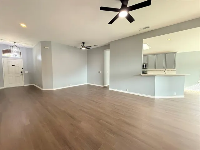 a view of a kitchen with a sink and cabinets