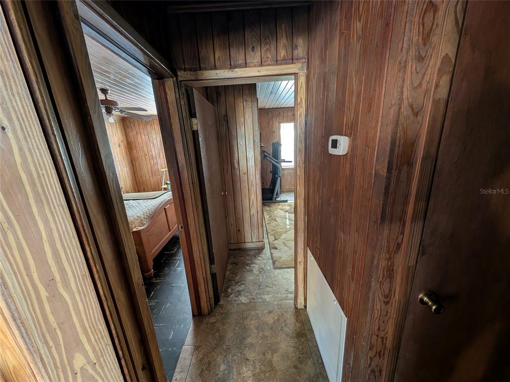 13668 Northeast 226th Avenue Road Salt Springs, FL 32134 - Photo 21 of 30 a view of hallway with shower and stairs