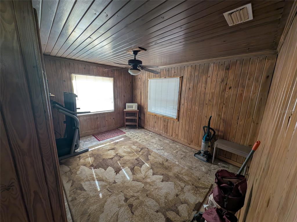 13668 Northeast 226th Avenue Road Salt Springs, FL 32134 - Photo 25 of 30 a view of workspace with furniture and window